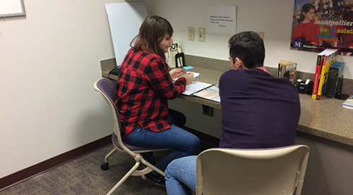 Students studying in media studio