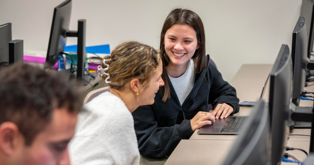 Students discuss coursework during a Scope & Methods of Political Science class.