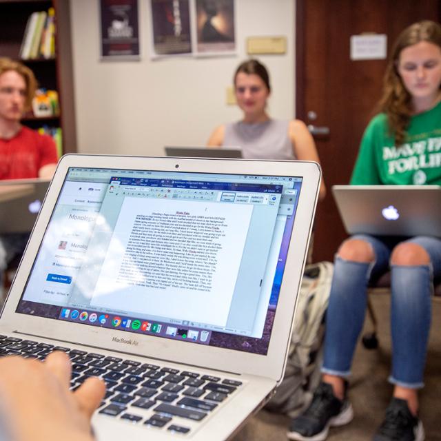 Students sit in a writing workshop