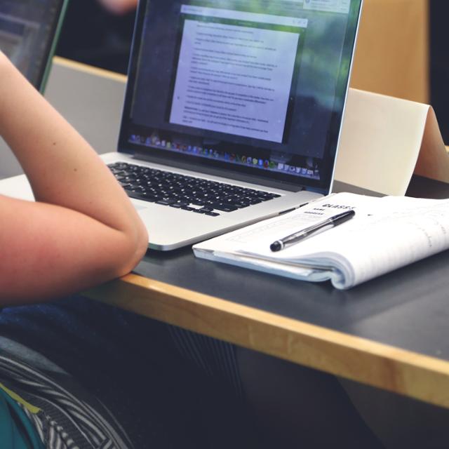 A student works on a laptop