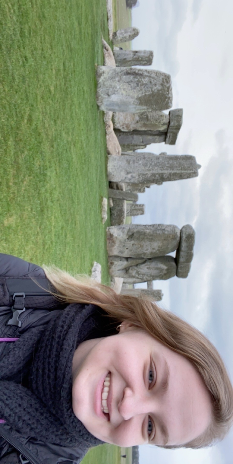 TCU student in Roehampton in front of standing stones