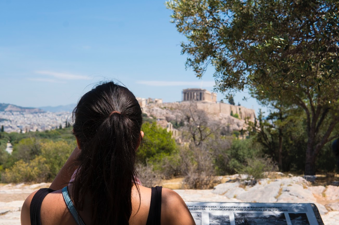 A student looks out over Athens, Greece