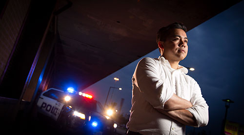 Johnny Nhan, assistant professor of criminal justice in TCU's AddRan College of Liberal Arts, photographed on West Lancaster Avenue in downtown Fort Worth
