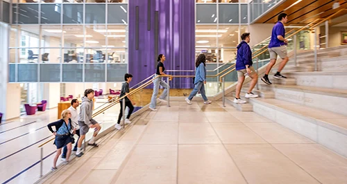 Prospective students touring the Mary Couts Burnett Library