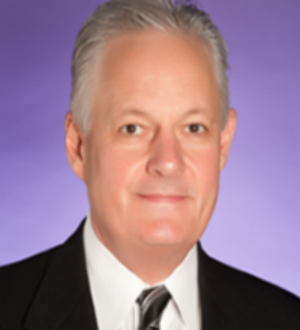 Jim Atwood with suit and purple background