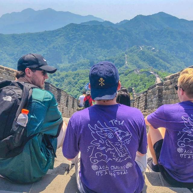 Students sitting on the Great Wall of China