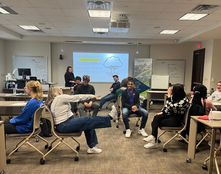 Students sitting in a classroom and talking